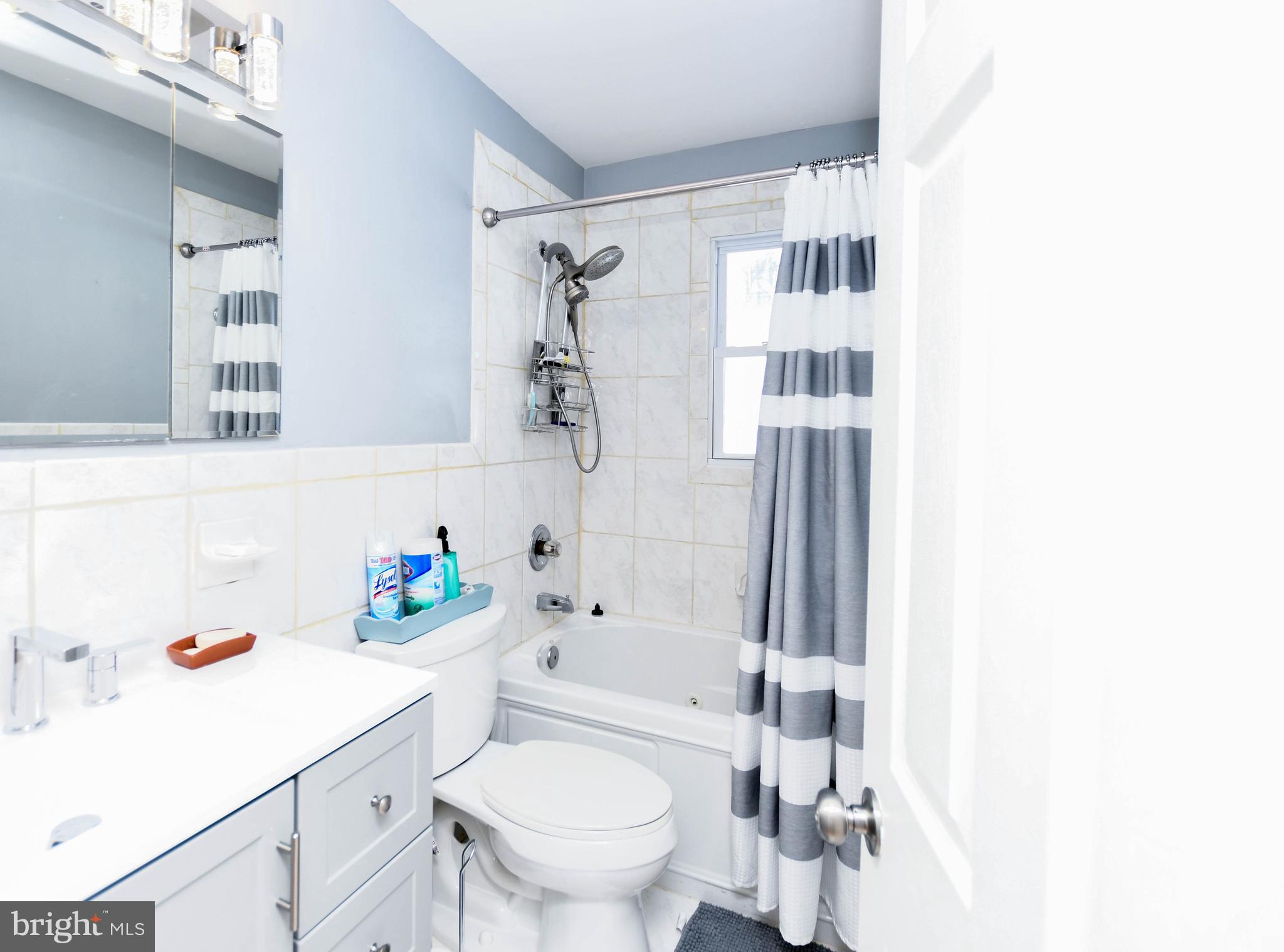 6714 Darby Road Hyattsville, MD 20784 - Photo 22 of 35 a bathroom with a sink toilet and shower