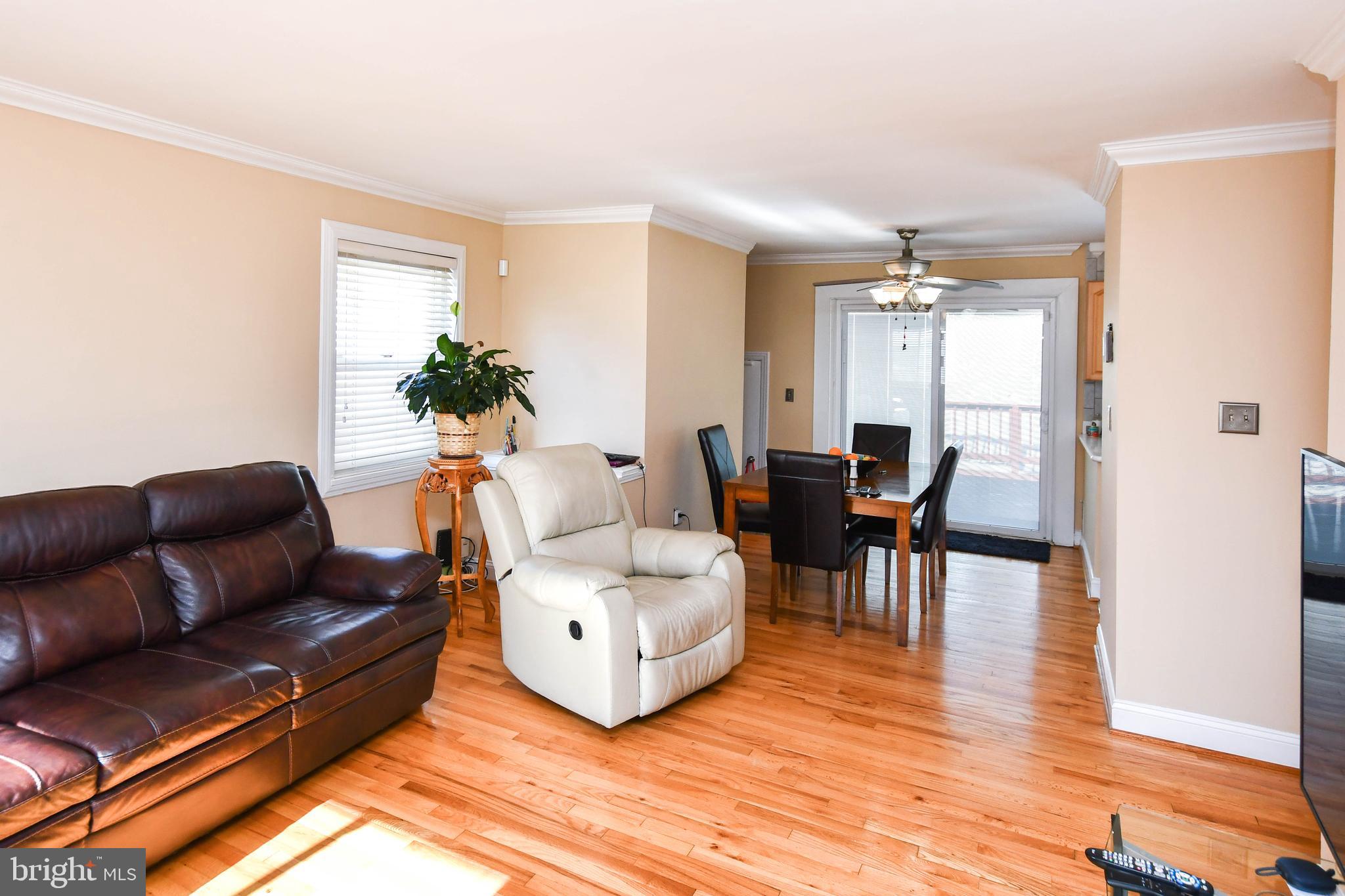 6714 Darby Road Hyattsville, MD 20784 - Photo 6 of 35 a living room with furniture and wooden floor