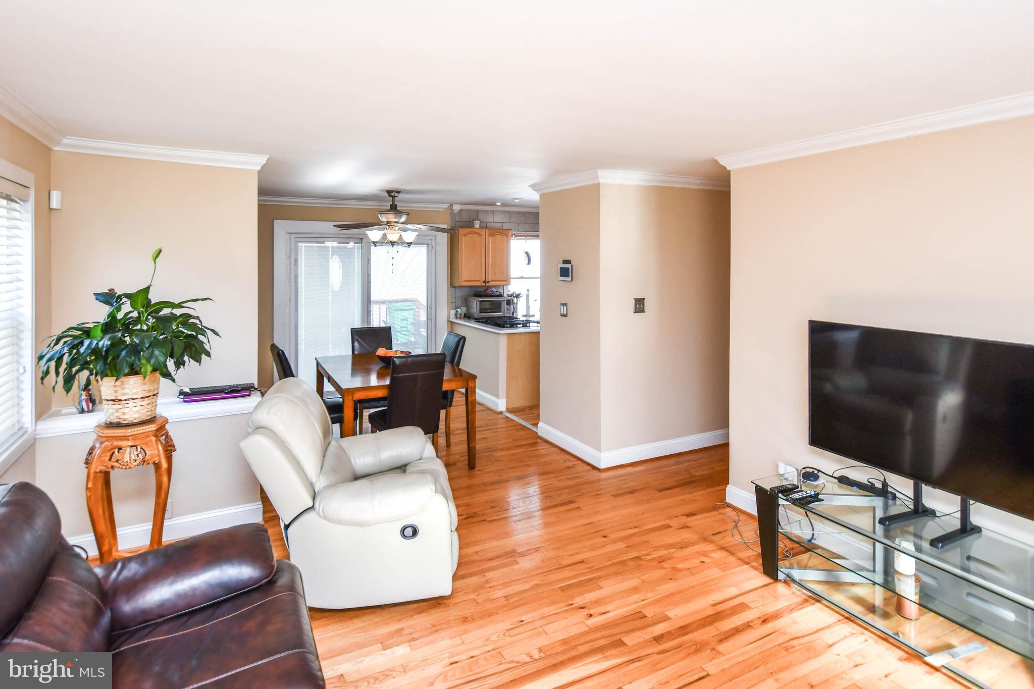 6714 Darby Road Hyattsville, MD 20784 - Photo 7 of 35 a living room with furniture and a flat screen tv