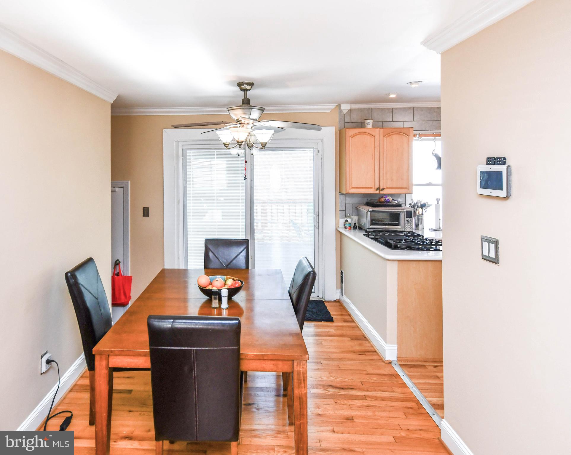 6714 Darby Road Hyattsville, MD 20784 - Photo 8 of 35 a dining room with furniture and a chandelier