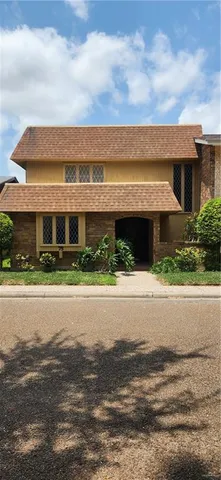 a view of a house with a yard and balcony