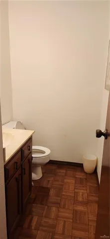 a bathroom with a toilet and a sink