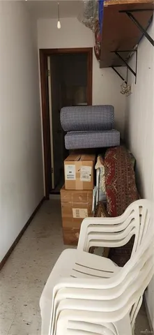a view of bedroom with a bed and wooden floor