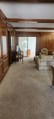 a view of living room with furniture and window