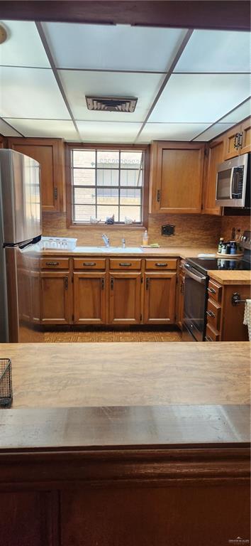 500 Wichita Avenue, Unit 75 McAllen, TX 78503 - Photo 10 of 45 a large kitchen with granite countertop a sink and dishwasher a stove top oven with wooden floor