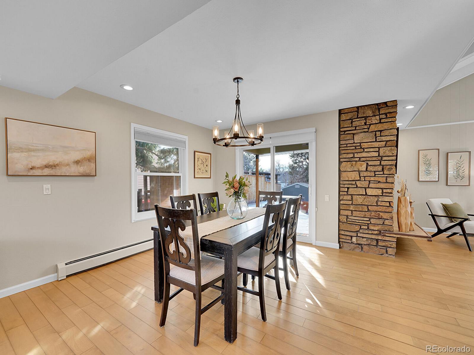 6849 South Elizabeth Circle Centennial, CO 80122 - Photo 11 of 44 a view of a dining room with furniture window and wooden floor