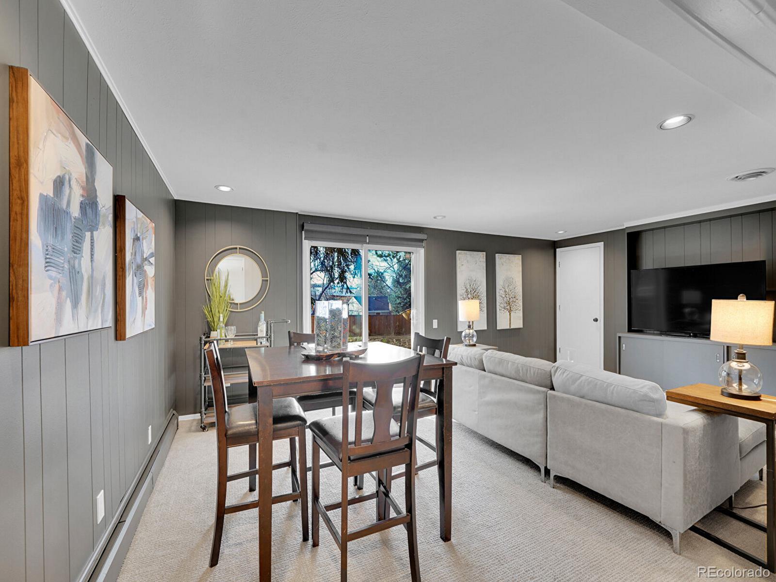 6849 South Elizabeth Circle Centennial, CO 80122 - Photo 17 of 44 a view of a dining room with furniture and a large window