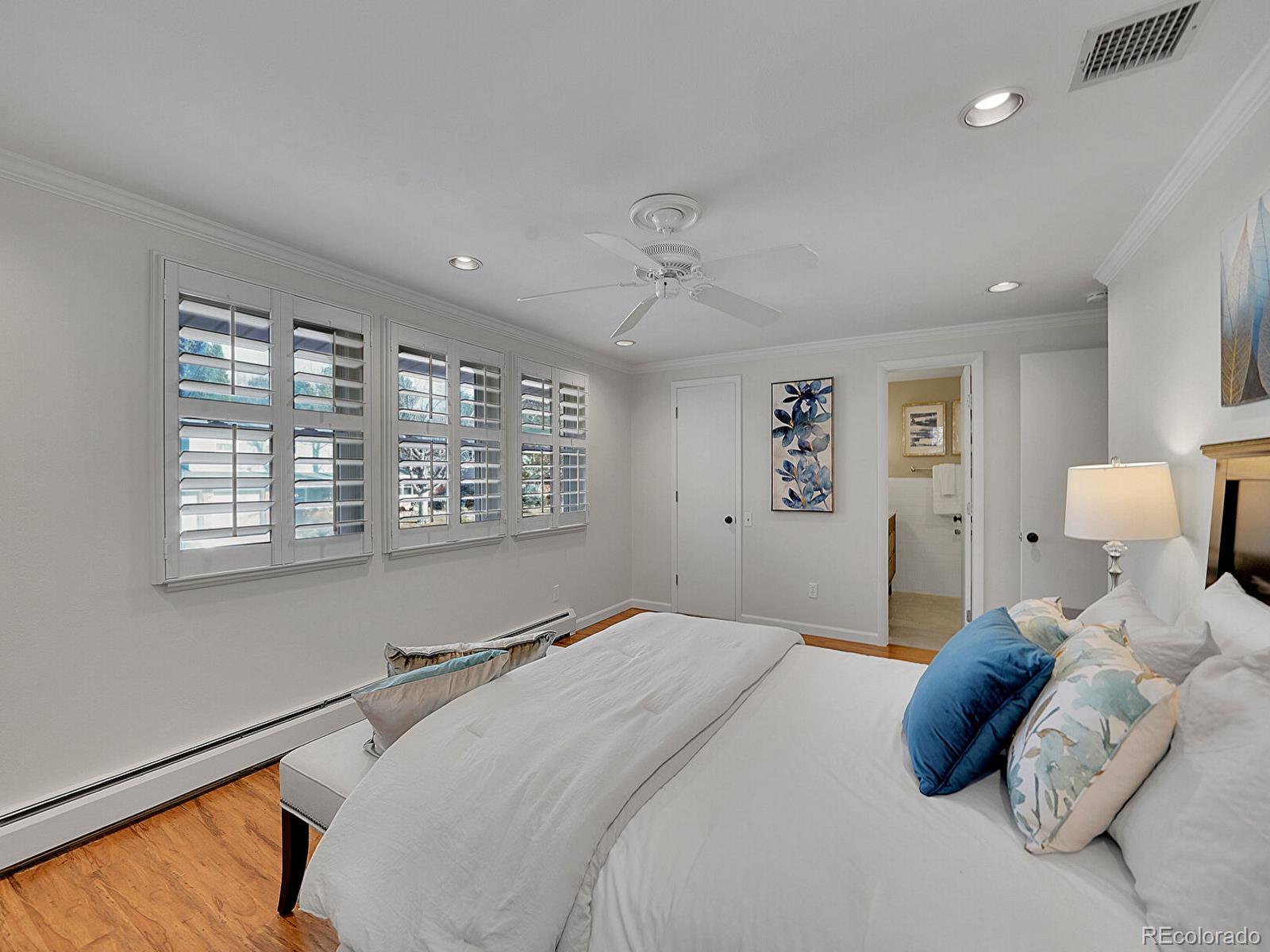 6849 South Elizabeth Circle Centennial, CO 80122 - Photo 22 of 44 a bedroom with a bed and a large window