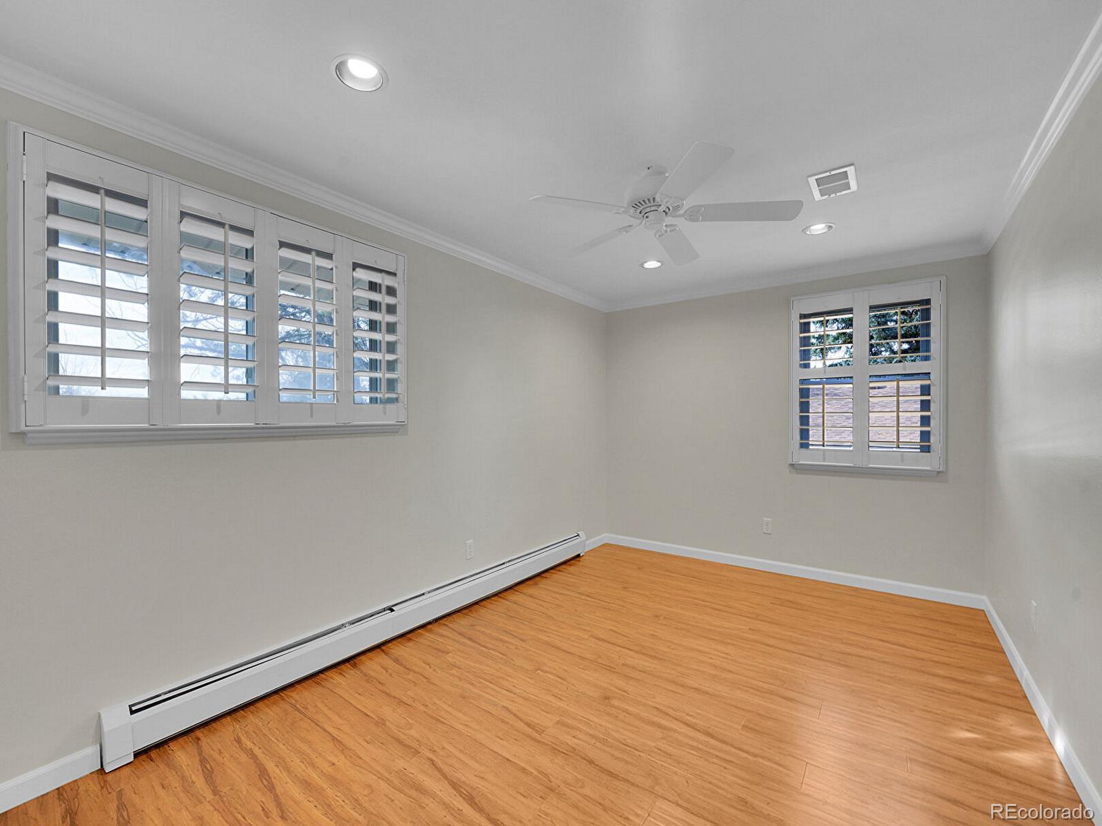 6849 South Elizabeth Circle Centennial, CO 80122 - Photo 27 of 44 a view of empty room with wooden floor and fan