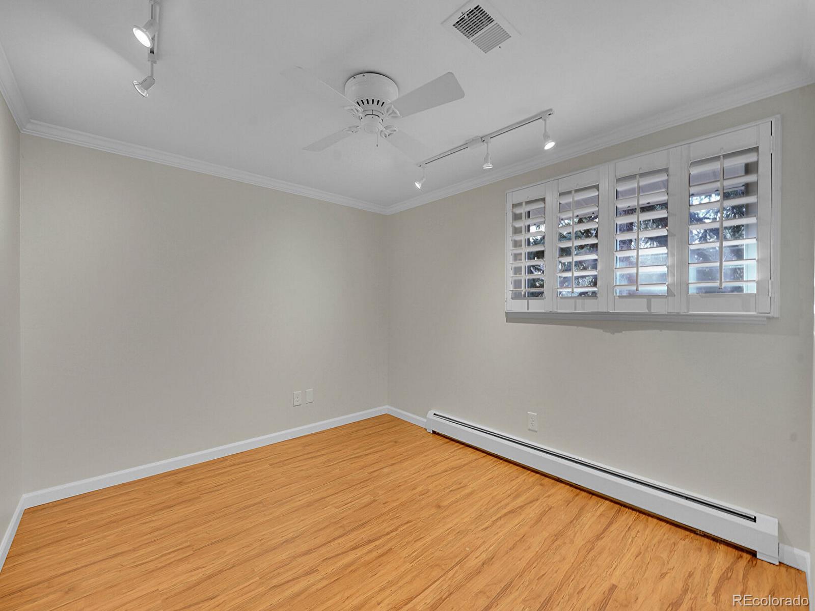 6849 South Elizabeth Circle Centennial, CO 80122 - Photo 28 of 44 wooden floor in an empty room with a window