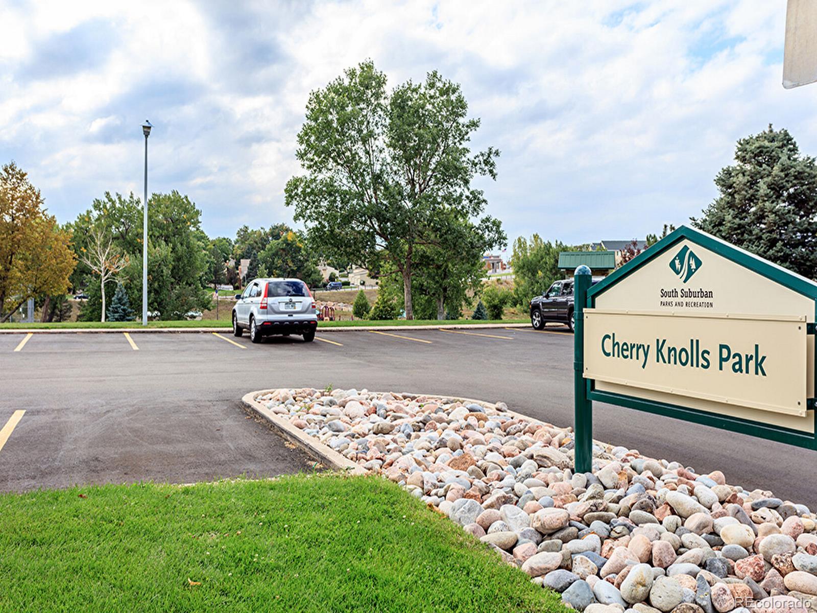 6849 South Elizabeth Circle Centennial, CO 80122 - Photo 38 of 44 a view of street with parking and sign board
