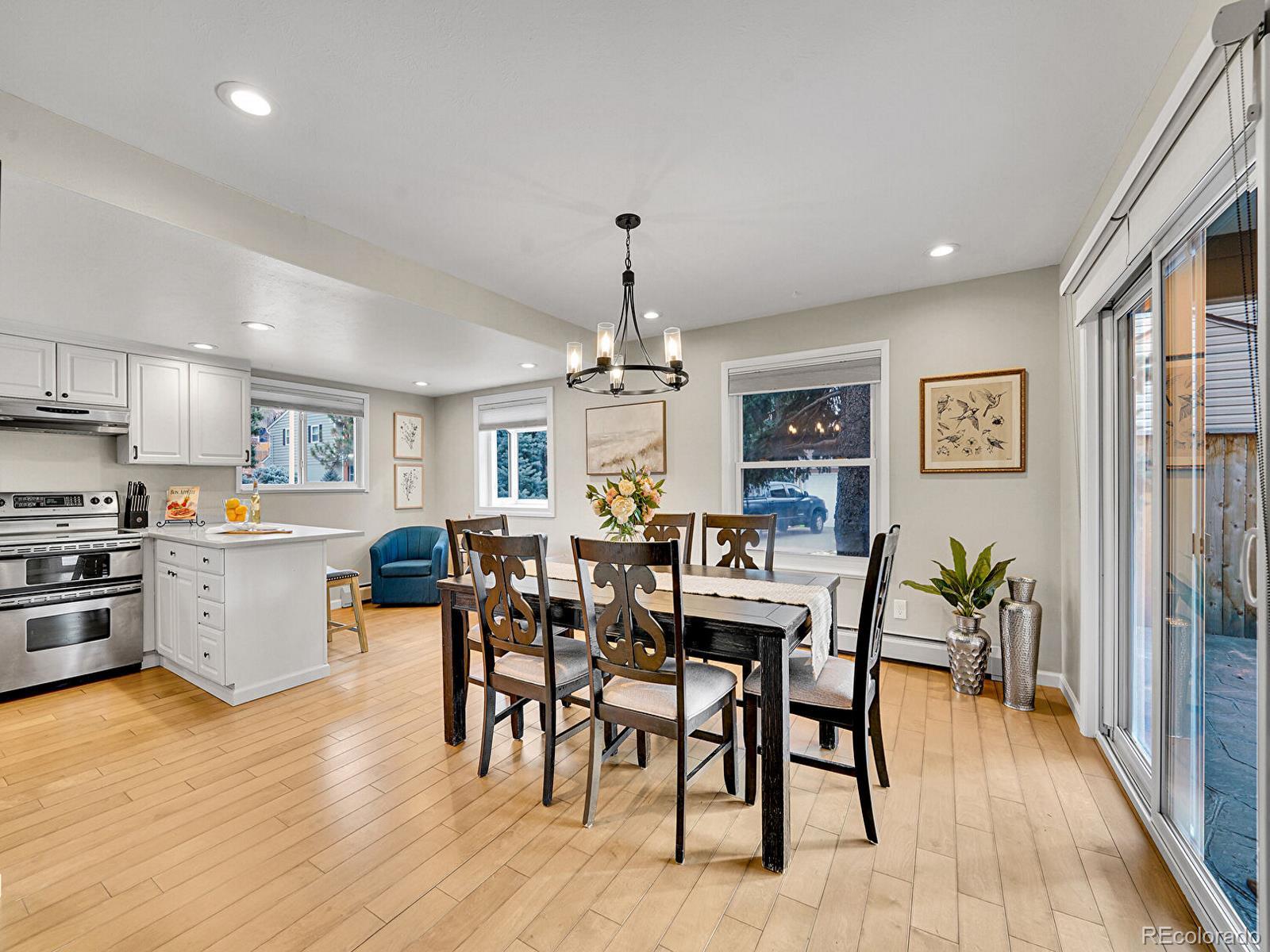 6849 South Elizabeth Circle Centennial, CO 80122 - Photo 10 of 44 a view of a dining room with furniture window and wooden floor