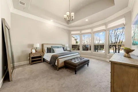 a bedroom with bed and window