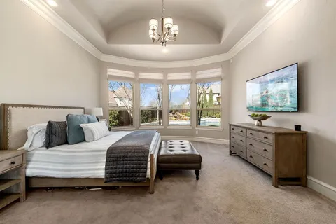 a bedroom with bed and window