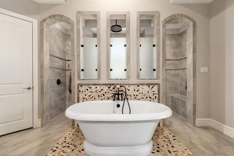 a bathroom with a bathtub and shower