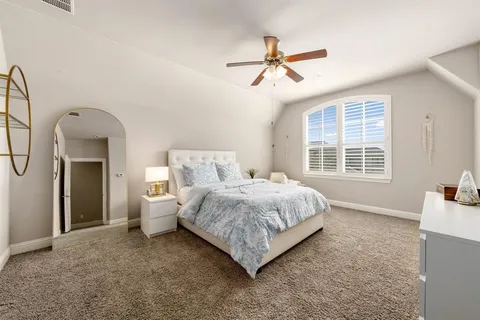 a bed room with a bed and a window