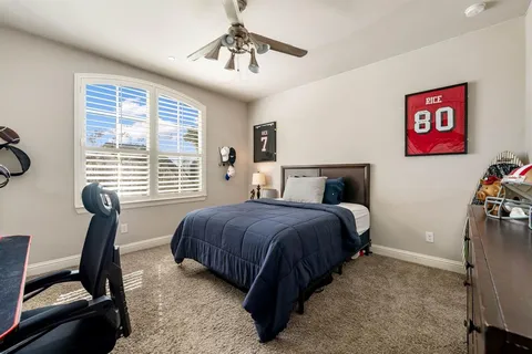 a bedroom with a bed and furniture