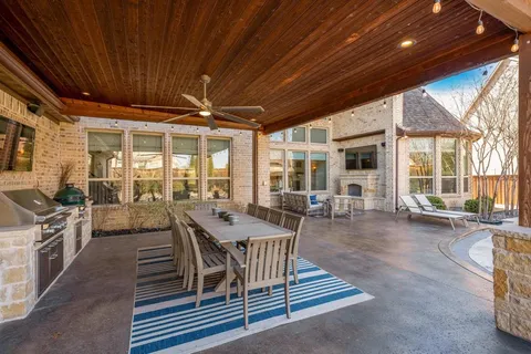 a view of a dining room with furniture wooden floor and chandelier