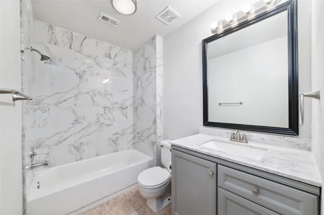 a view of kitchen with marble wall