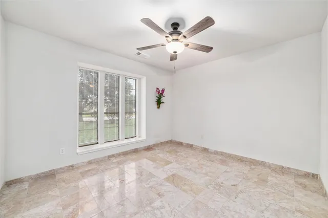 a bathroom with a bathtub toilet and shower