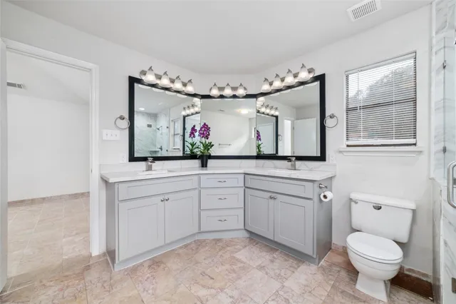 a bathroom with a tub a sink and a mirror