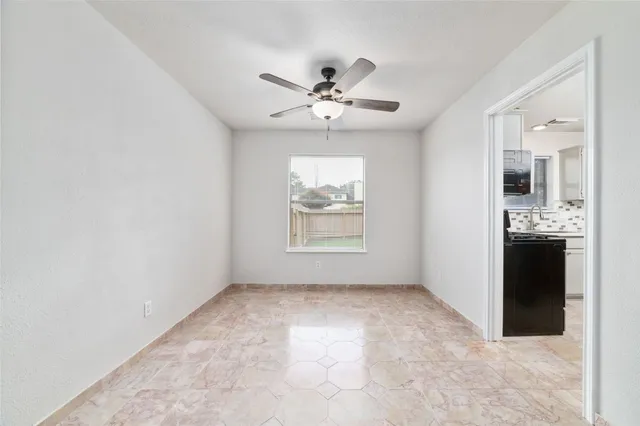 a view of an empty room with a bathroom