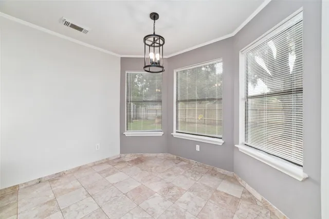 a kitchen with cabinets and oven
