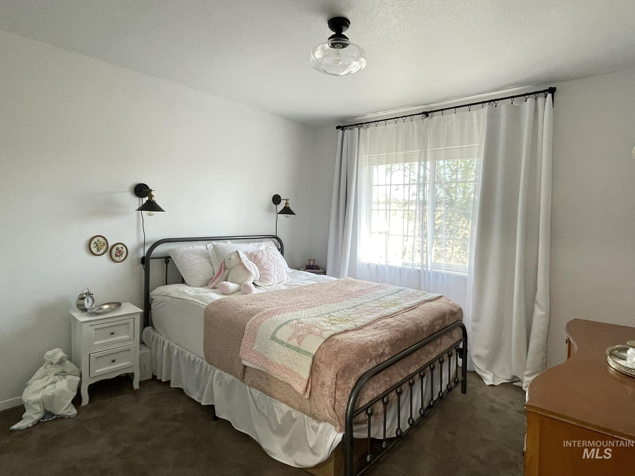 637 Leitch Creek Road Kooskia, ID 83539 - Photo 20 of 38 Bedroom featuring dark carpet
