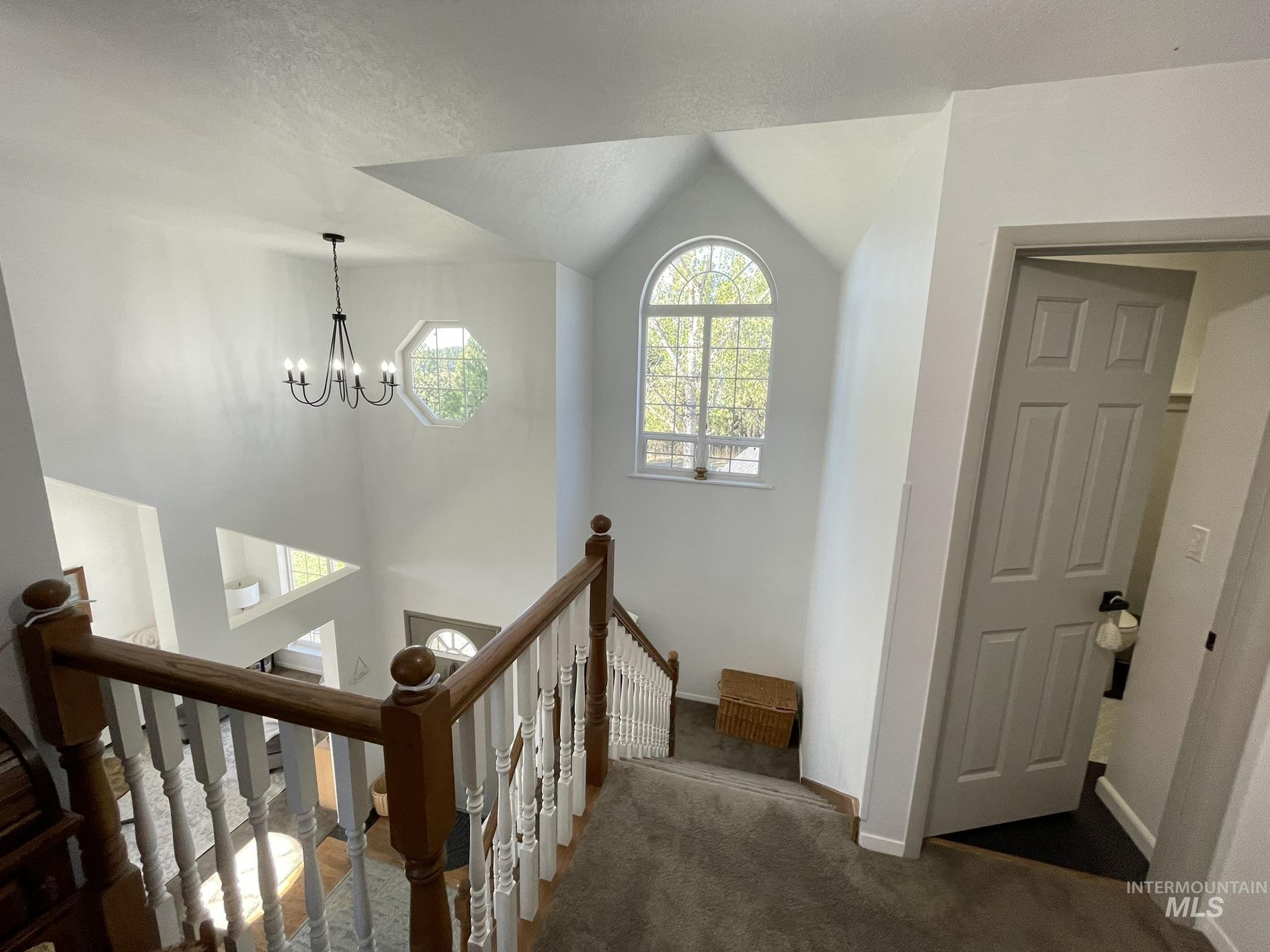 637 Leitch Creek Road Kooskia, ID 83539 - Photo 23 of 38 Stairway with carpet flooring and suspended lighting