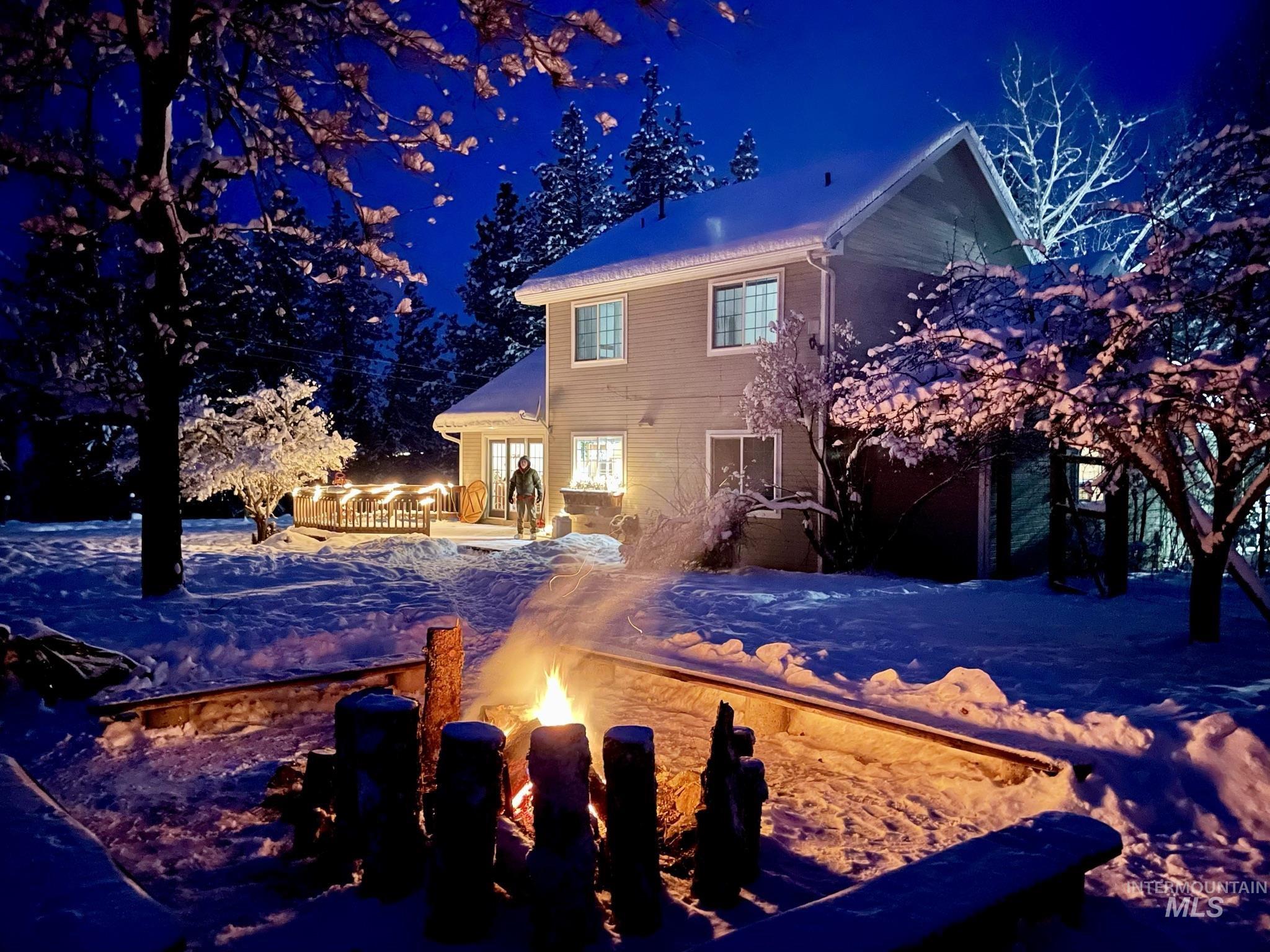 637 Leitch Creek Road Kooskia, ID 83539 - Photo 34 of 38 Snow covered property with an outdoor fire pit