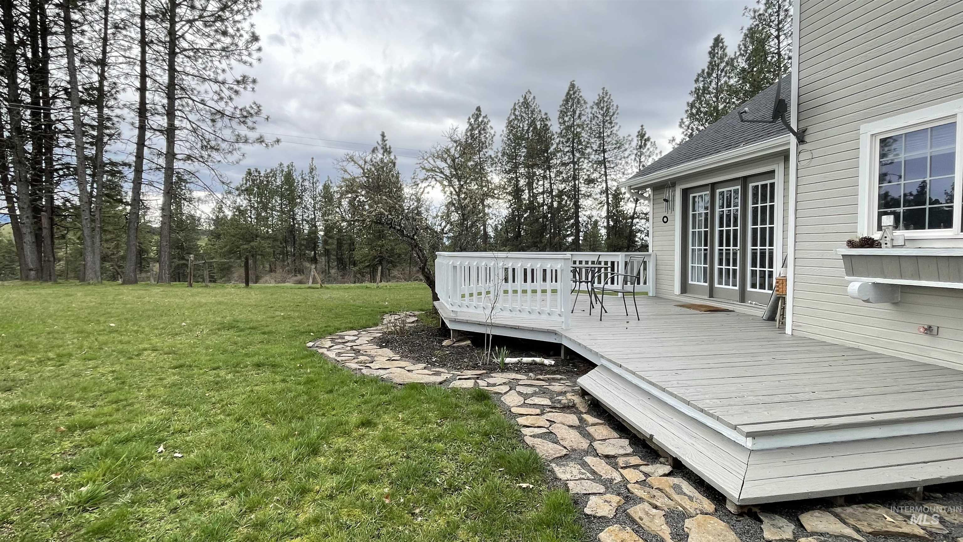 637 Leitch Creek Road Kooskia, ID 83539 - Photo 6 of 38 View of green lawn featuring a wooden deck