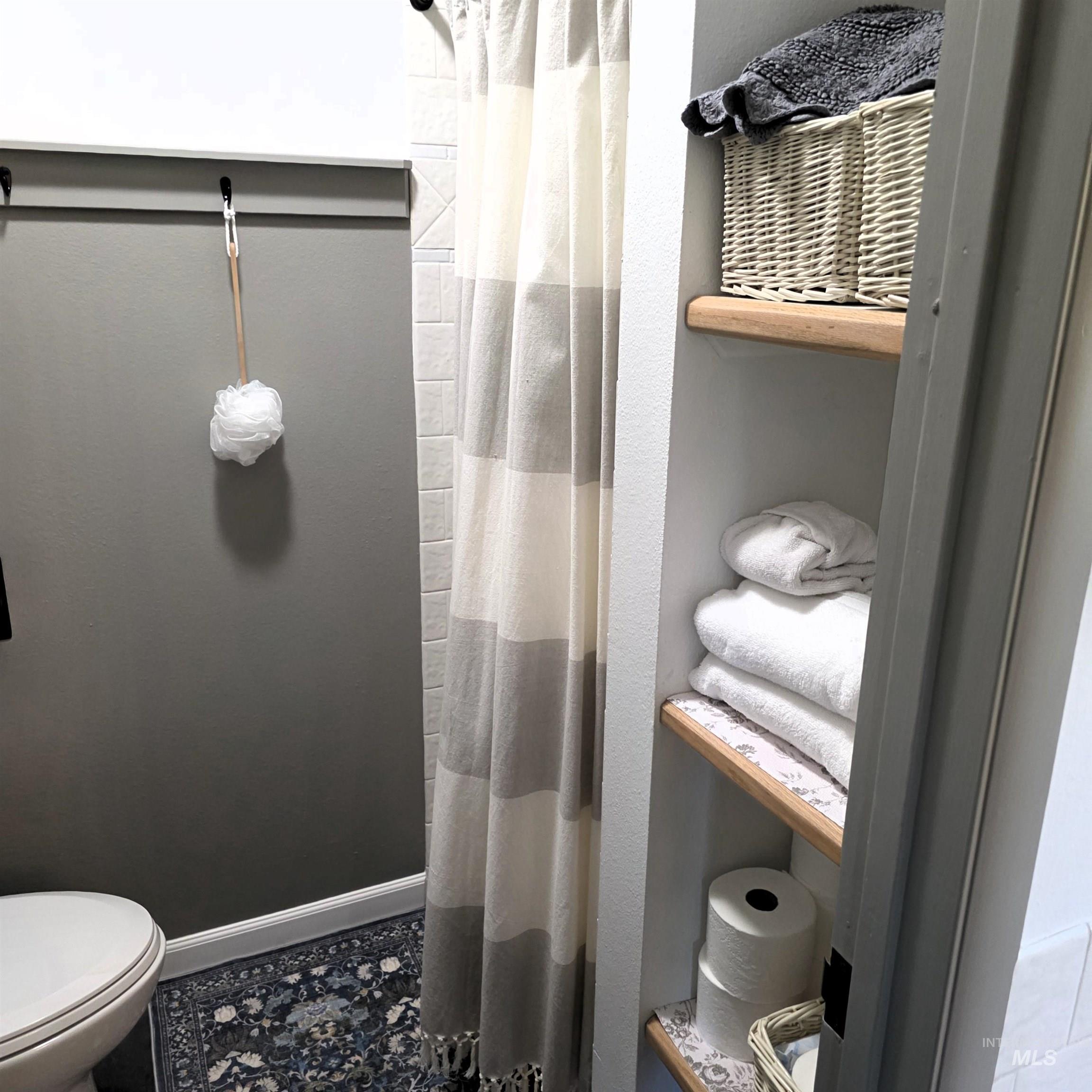 637 Leitch Creek Road Kooskia, ID 83539 - Photo 10 of 38 Full bath featuring toilet and curtained shower