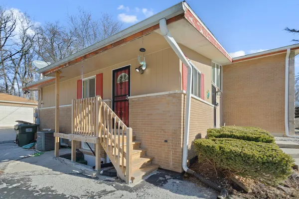 a view of a house with a small yard