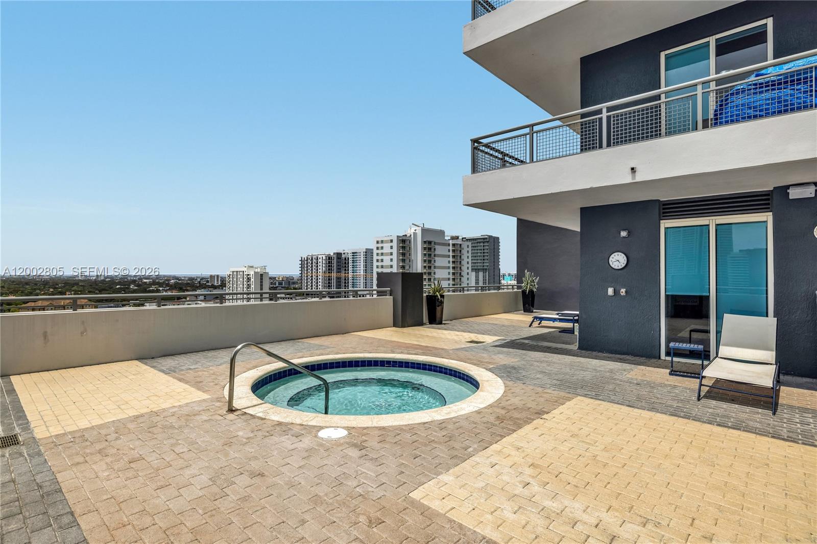 60 Southwest 13th Street, Unit 1124 Miami, FL 33130 - Photo 28 of 30 a view of a house with swimming pool and sitting area
