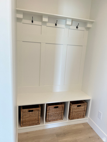1951 2900 West Provo, UT 84601 - Photo 10 of 21 Built-in mudroom bench with three storage cubbies, integrated coat hooks, and an upper display shelf