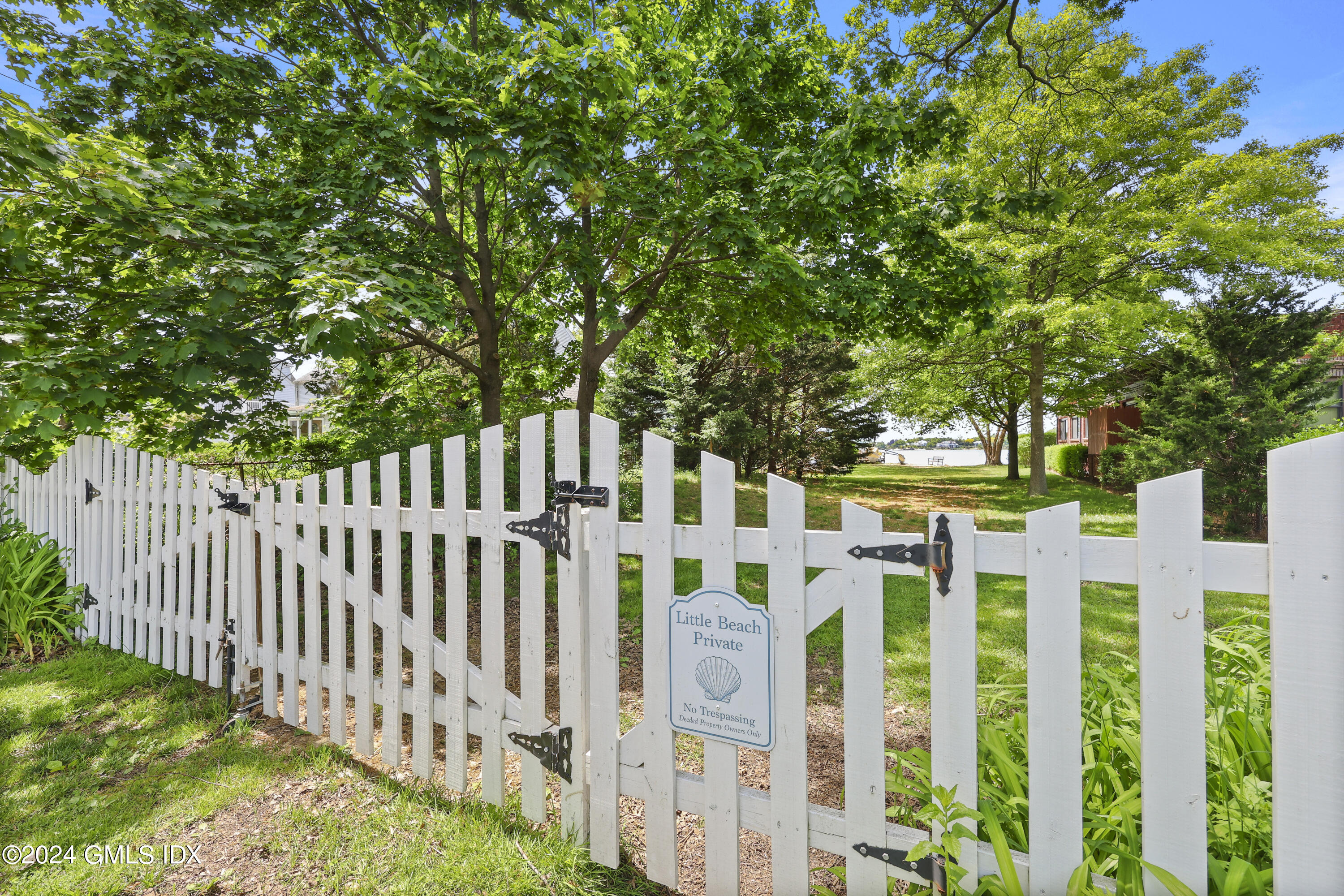 22 Keofferam Road, Unit REAR Old Greenwich, CT 06870 - Photo 11 of 15 a view of small yard with wooden fence