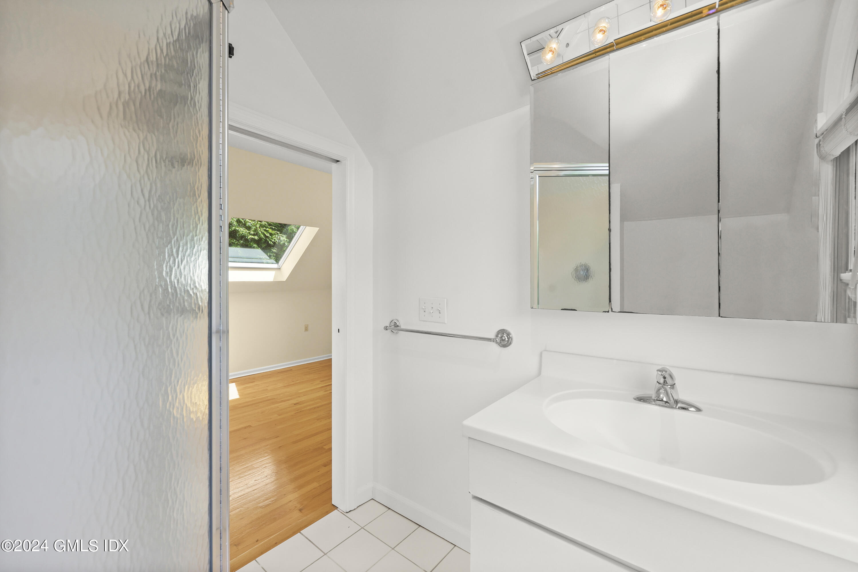 22 Keofferam Road, Unit REAR Old Greenwich, CT 06870 - Photo 7 of 15 a bathroom with a sink and a mirror