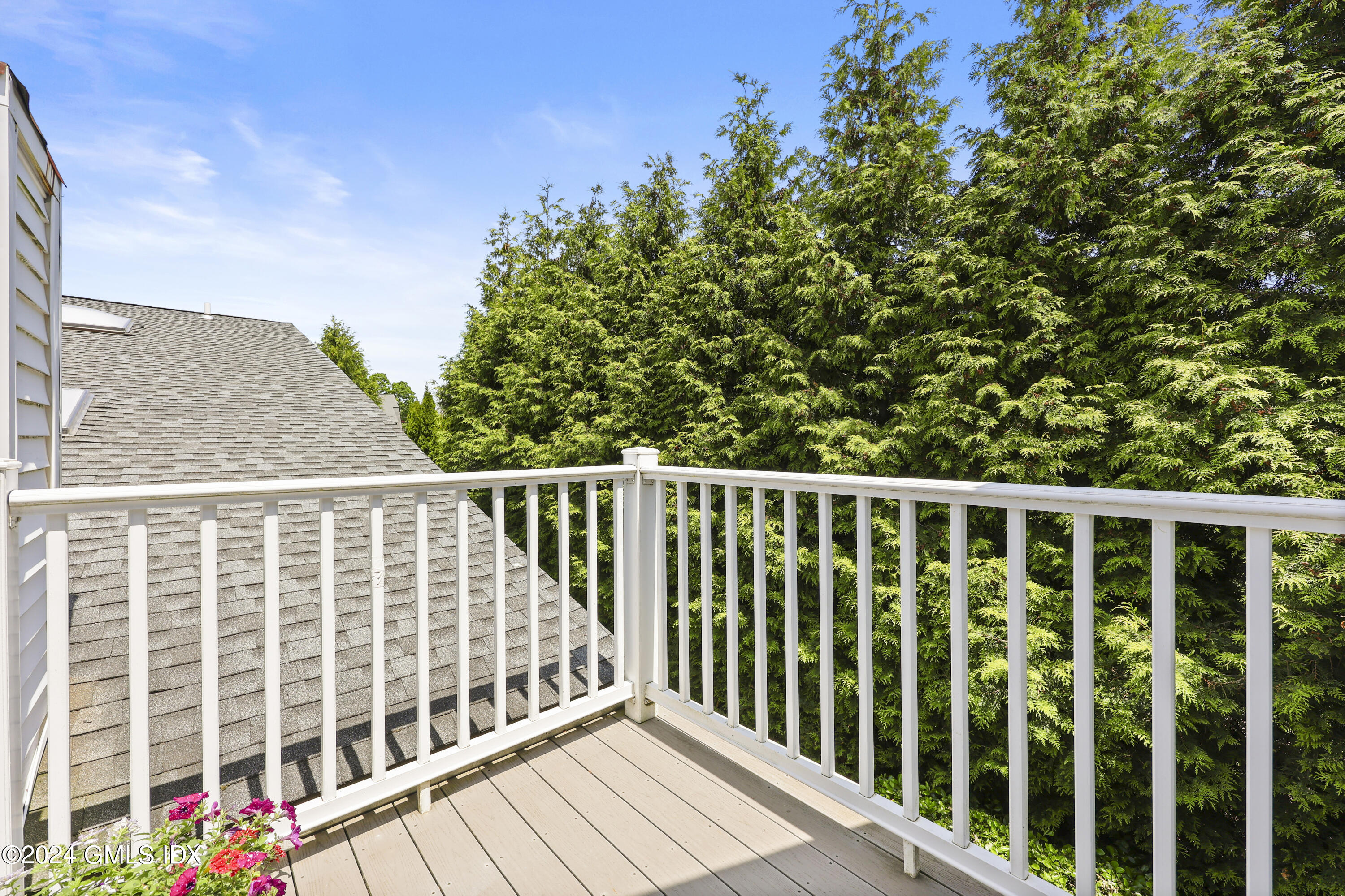 22 Keofferam Road, Unit REAR Old Greenwich, CT 06870 - Photo 9 of 15 a balcony with wooden floor and fence
