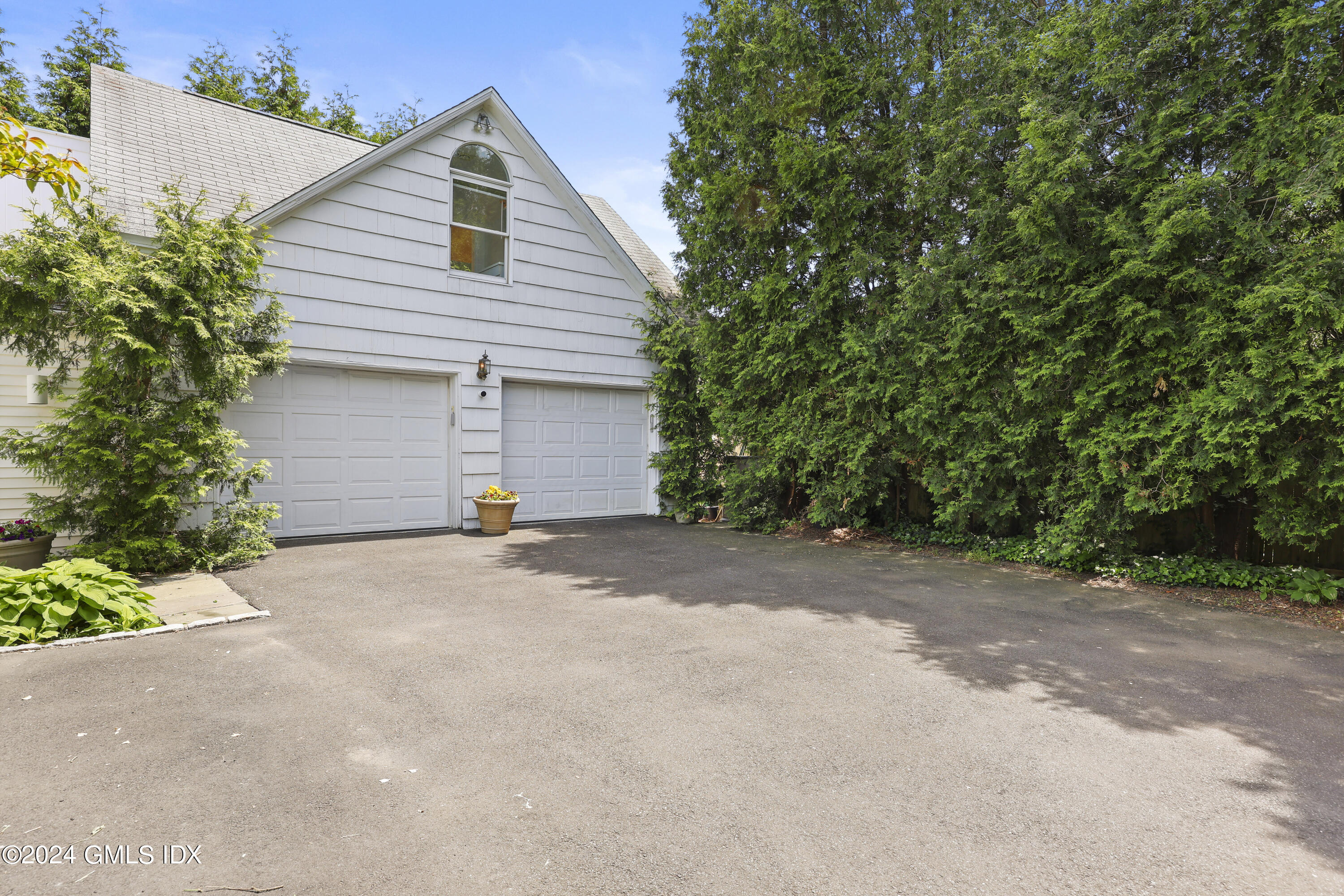 22 Keofferam Road, Unit REAR Old Greenwich, CT 06870 - Photo 10 of 15 a view of a house with a outdoor space and backyard