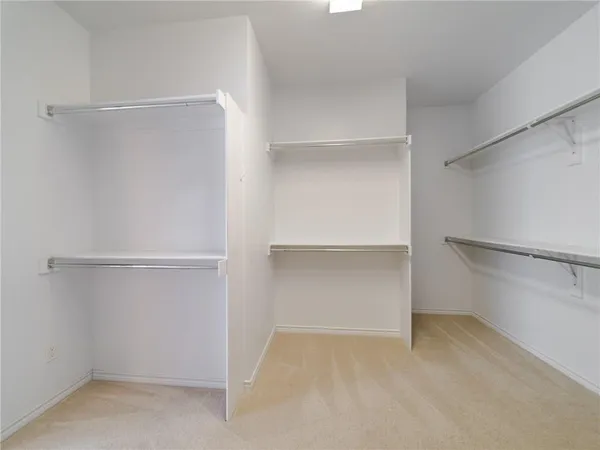 a view of an empty walk in closet