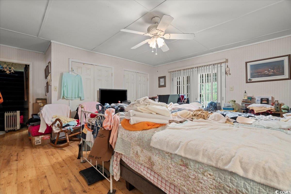 2776 Holly Road Marion, SC 29571 - Photo 14 of 29 Bedroom with radiator, two closets, light wood-sty