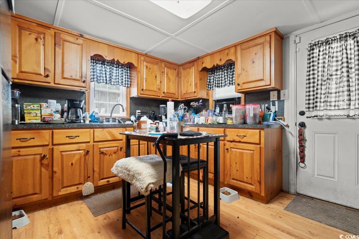 2776 Holly Road Marion, SC 29571 - Photo 6 of 29 Kitchen with light wood-style flooring, dark count