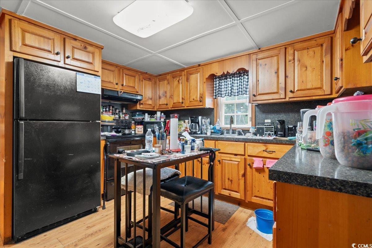 2776 Holly Road Marion, SC 29571 - Photo 7 of 29 Kitchen with freestanding refrigerator, dark count