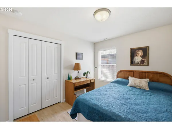 a bedroom with a bed and a table