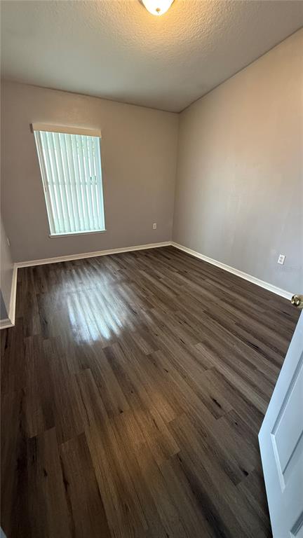 2210 Nicollett Way Leesburg, FL 34748 - Photo 12 of 31 wooden floor in an empty room