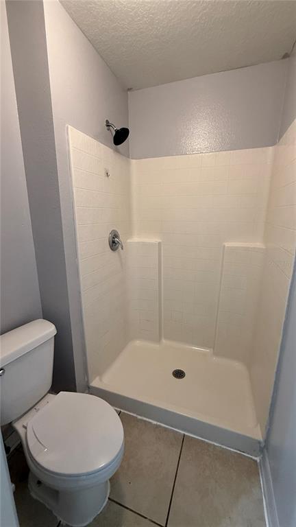 2210 Nicollett Way Leesburg, FL 34748 - Photo 19 of 31 a bathroom with a toilet and a shower