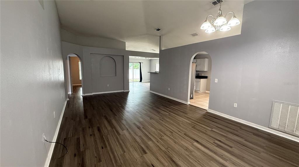 2210 Nicollett Way Leesburg, FL 34748 - Photo 2 of 31 a view of empty room with wooden floor