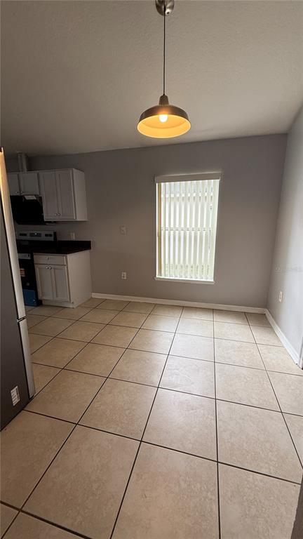 2210 Nicollett Way Leesburg, FL 34748 - Photo 4 of 31 a view of an empty room with a window