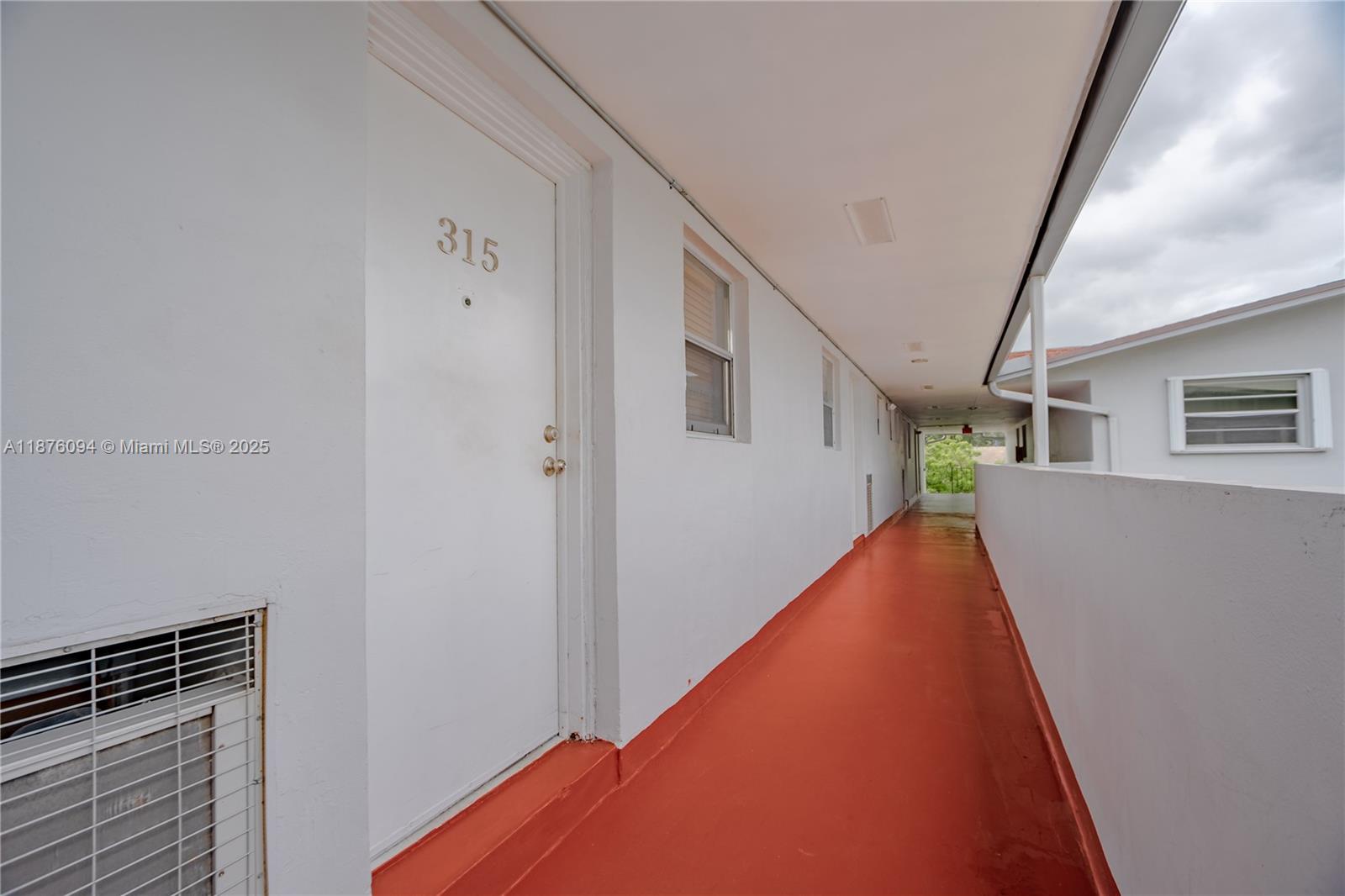 120 Royal Palm Road, Unit 315 Hialeah Gardens, FL 33016 - Photo 13 of 15 a view of a staircase