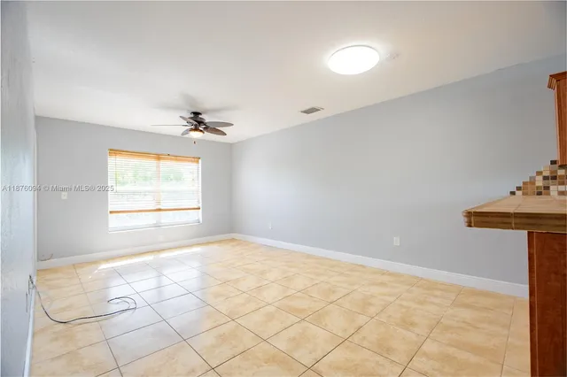 a view of an empty room and window